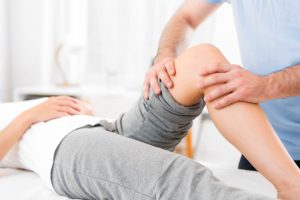 View of a Young attractive woman being manipulated by physiotherapist